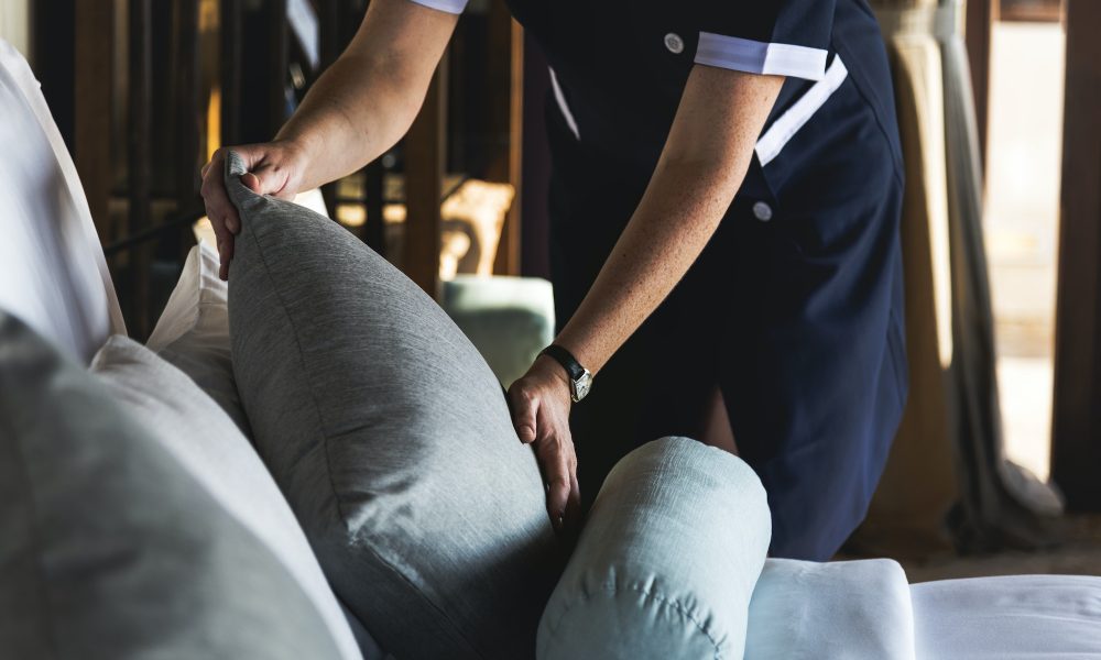 Housekeeper cleaning a hotel room